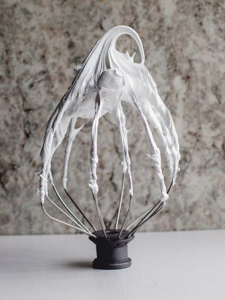 whipped meringue on a whisk