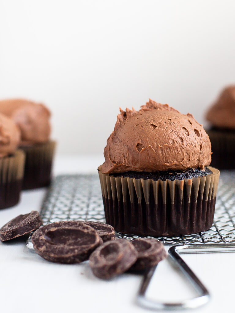 A gluten free chocolate cupcake topped with Dark Chocolate Buttercream Frosting