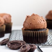 A gluten free chocolate cupcake topped with Dark Chocolate Buttercream Frosting