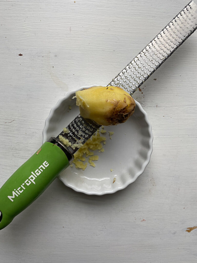 Freshly grated ginger with microplane