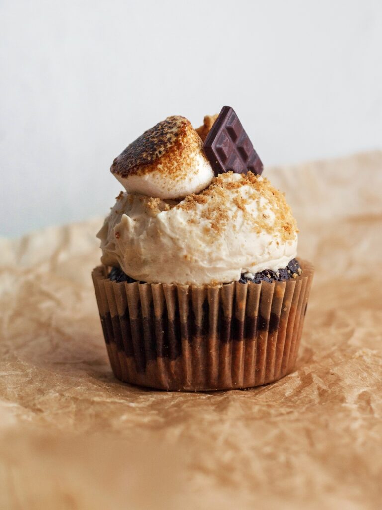 A decorated gluten free s'mores cupcake