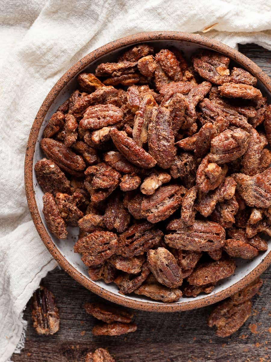 a bowl of gluten free cinnamon spiced pecans
