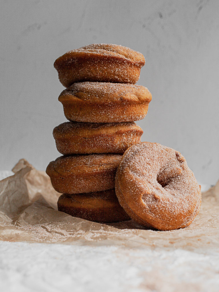 A stack of healthy gluten free baked pumpkin donuts