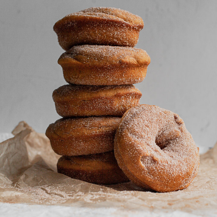 a stack of baked gluten free pumpkin donuts