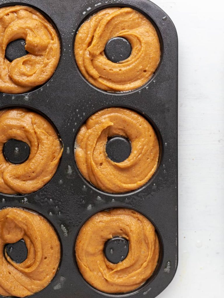healthy baked pumpkin donuts in a donut pan