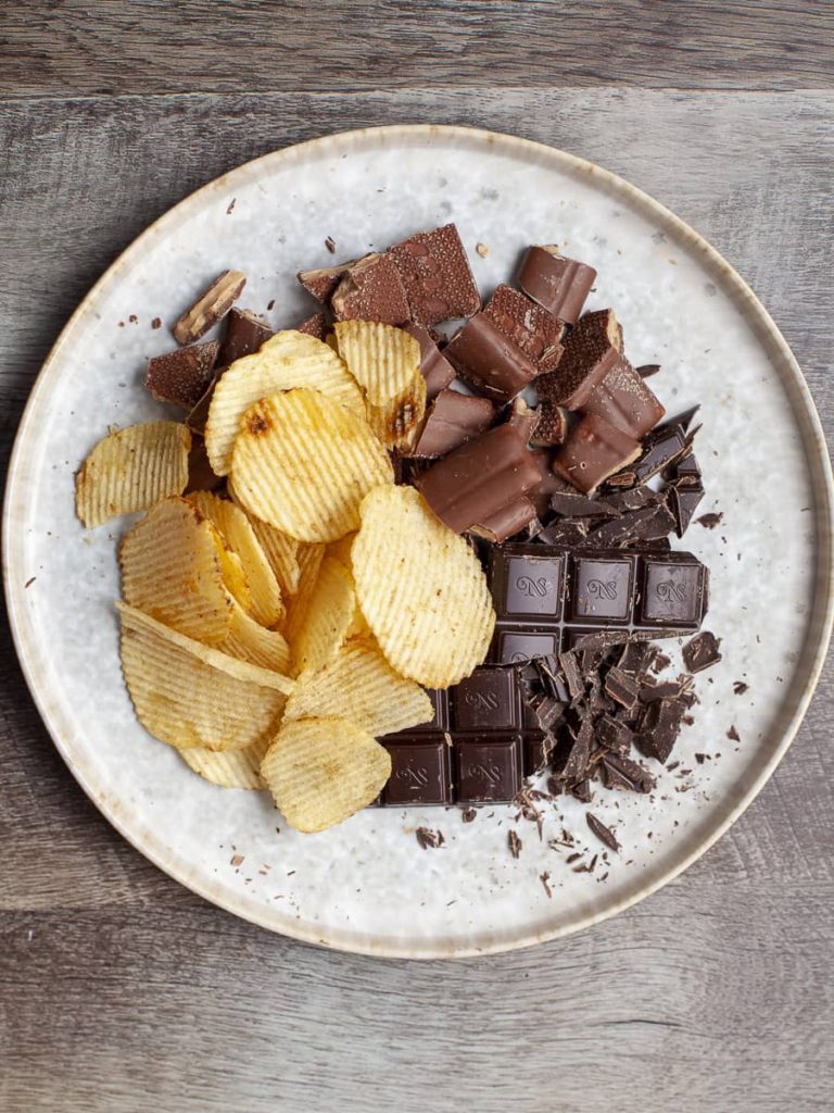 a plate with potato chips, heath bars and chopped up chocolate