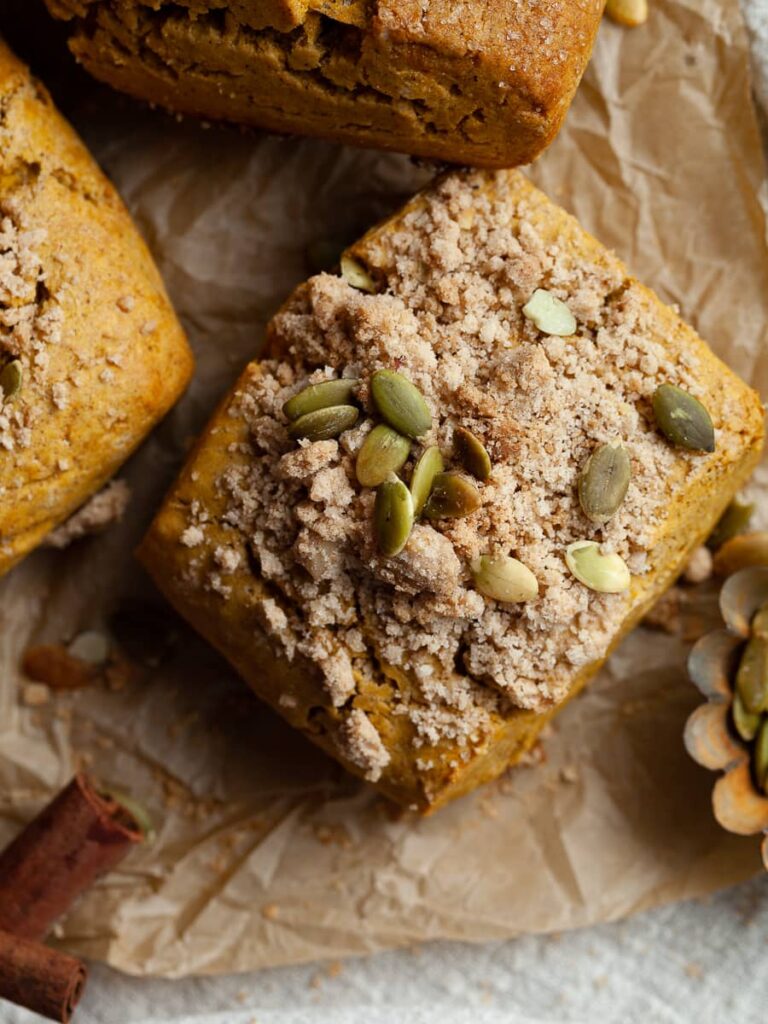 gluten free pumpkin scone topped with brown sugar streusel and pumpkin seeds