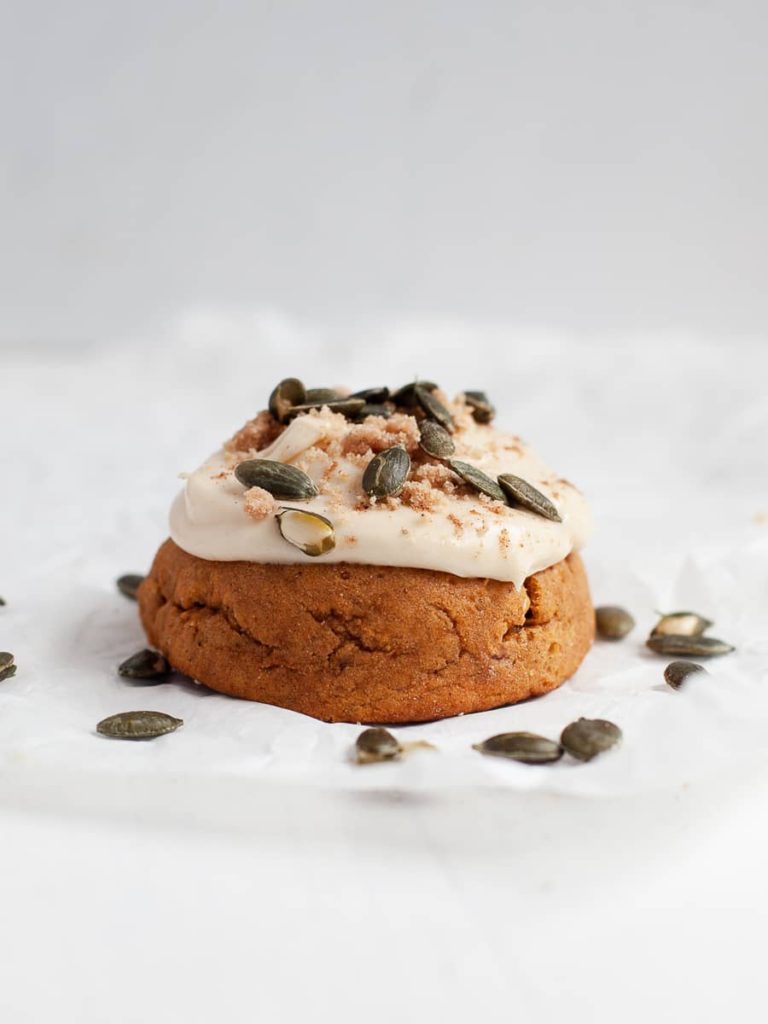 gluten free pumpkin cookie topped with brown sugar cream cheese frosting