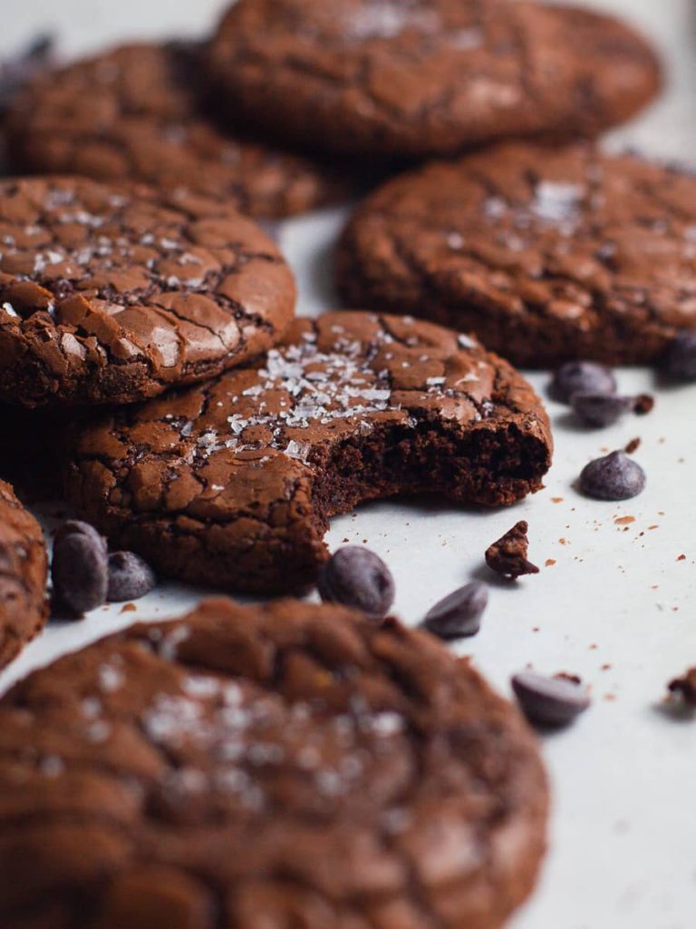 Delectable gluten free chocolate brownie cookies with a shiny, crinkle outside with a fudgy center. Simple one bowl recipe.