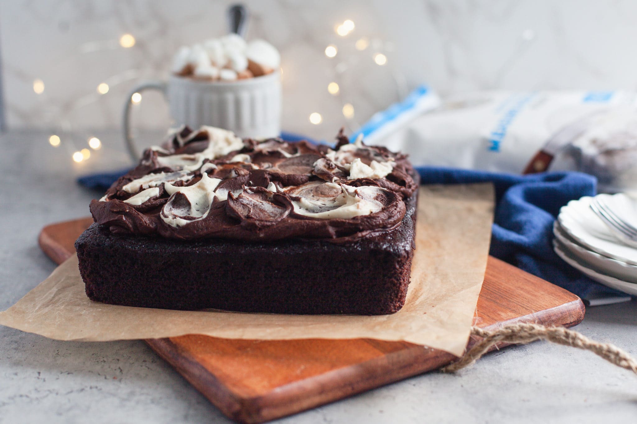 A decadent chocolate cake made with King Arthur Gluten Free Measure for Measure Flour, filled with Toasted Marshmallow Cream and topped with a delectable Hot Chocolate Frosting.