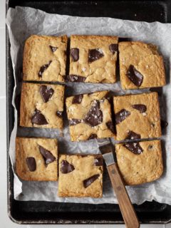 gluten free blondies topped with milk chocolate and flaky sea salt
