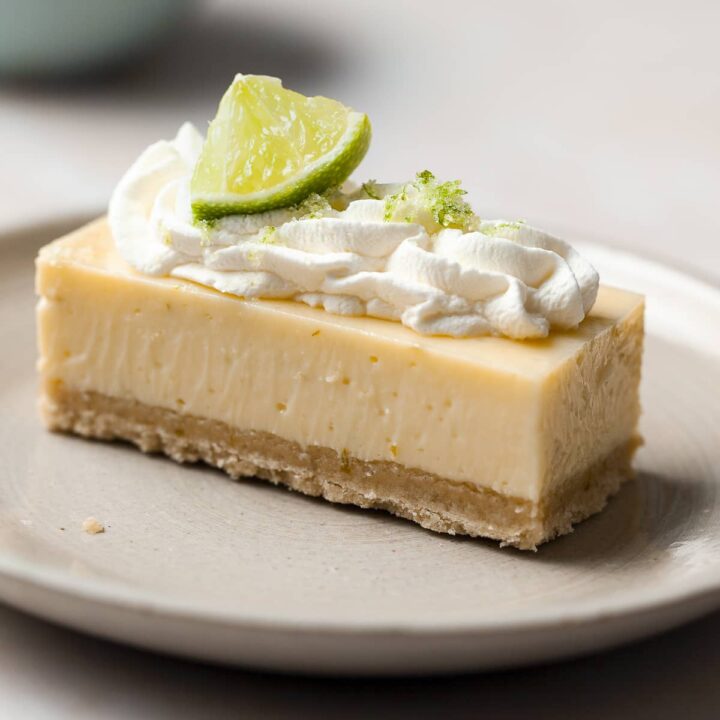 a slice of gluten free key lime pie bars made with a gluten free shortbread crust