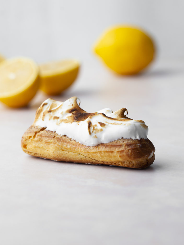 Gluten Free Lemon Meringue Éclairs filled with lemon mousse and topped with toasted meringue