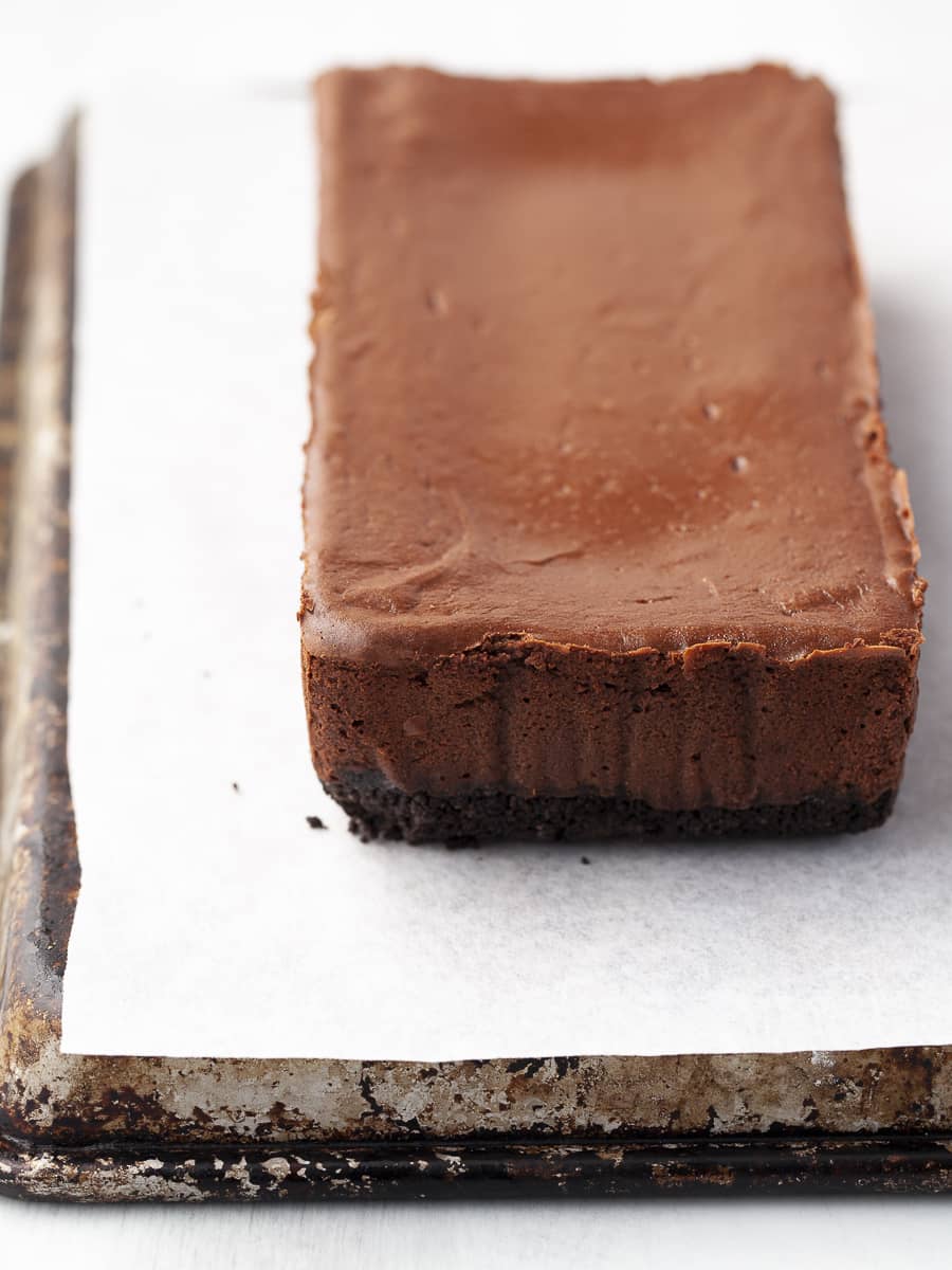 a dark chocolate cheesecake made with a cookie crust