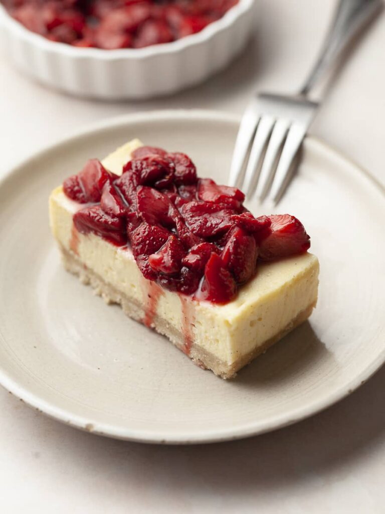 gluten free vanilla bean cheesecake with roasted strawberries