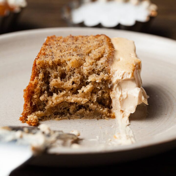 a slice of banana cake with salted caramel frosting