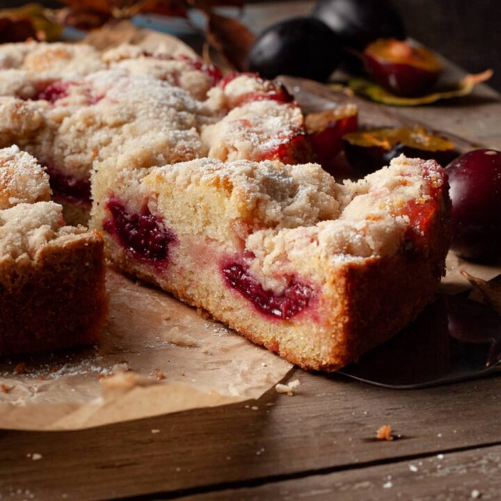 sliced traditional austrian plum cake on a piece of parchment paper