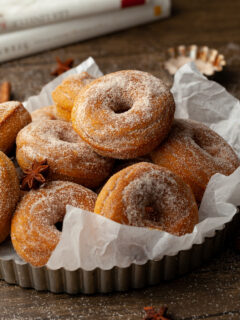 A stack of healthy gluten free baked pumpkin donuts