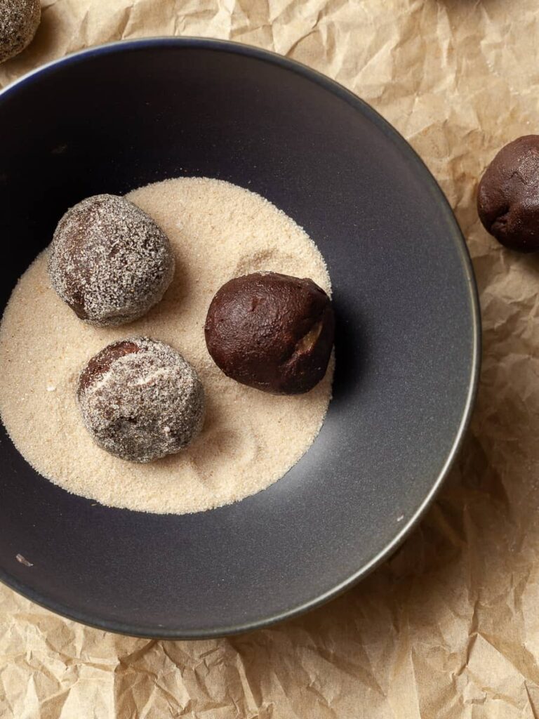 a bowl with ginger sugar and gluten free chocolate ginger cookie dough
