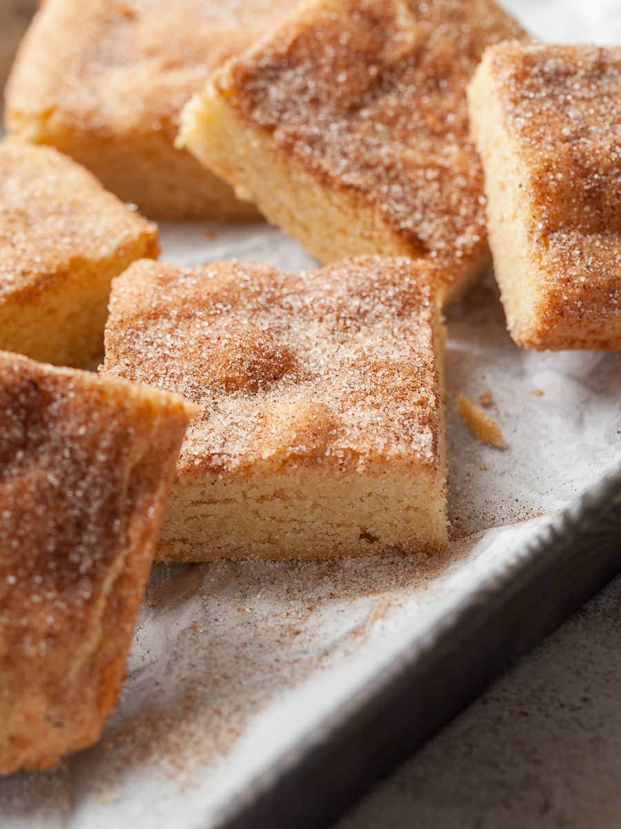gluten free snickerdoodle cookie bars on a sheet tray