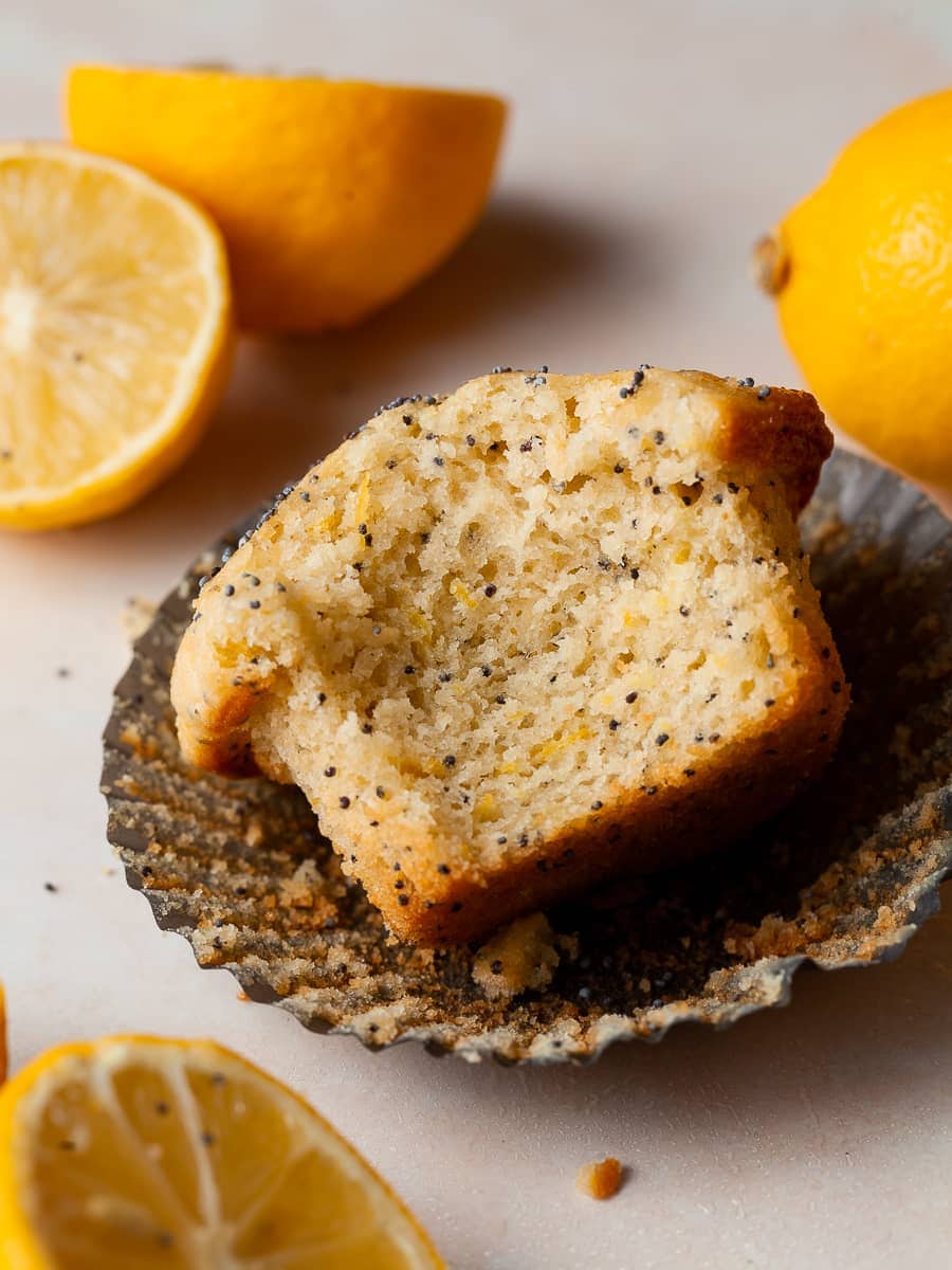 a lemon poppy seed muffin with a bite taken out of it