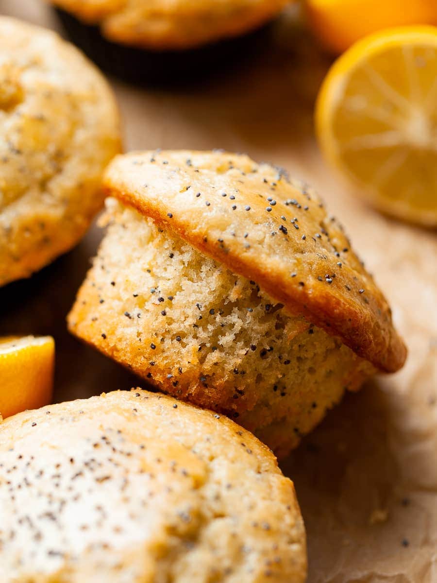 gluten free lemon poppy seed muffins on brown parchment paper 