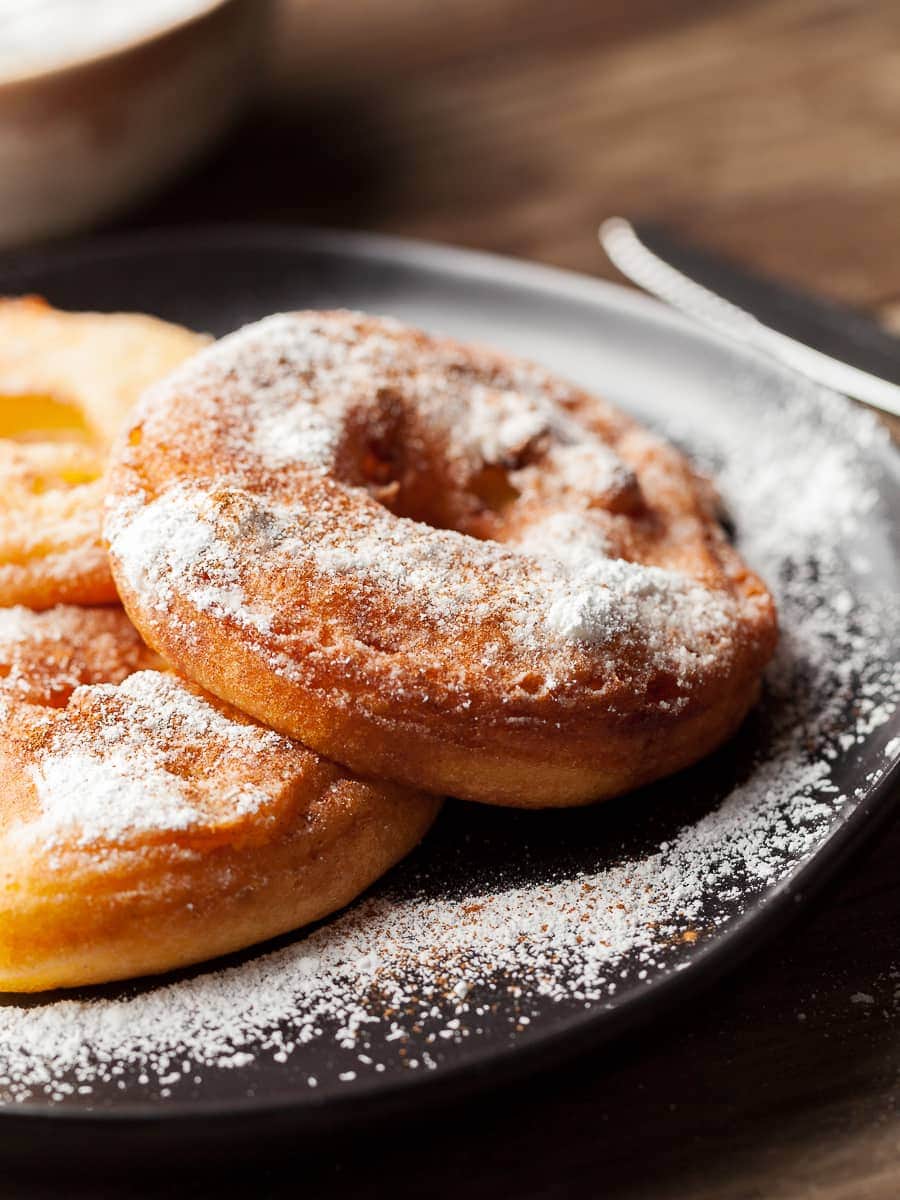 fried apple ring dusted with powdered sugar and ground cinnamon, gluten free apple rings, apfelradln