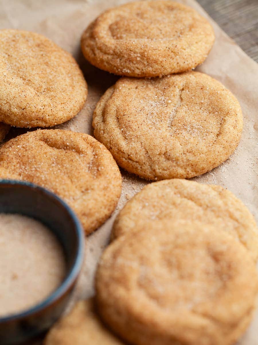 gluten free brown butter snickerdoodles on brown parchment paper