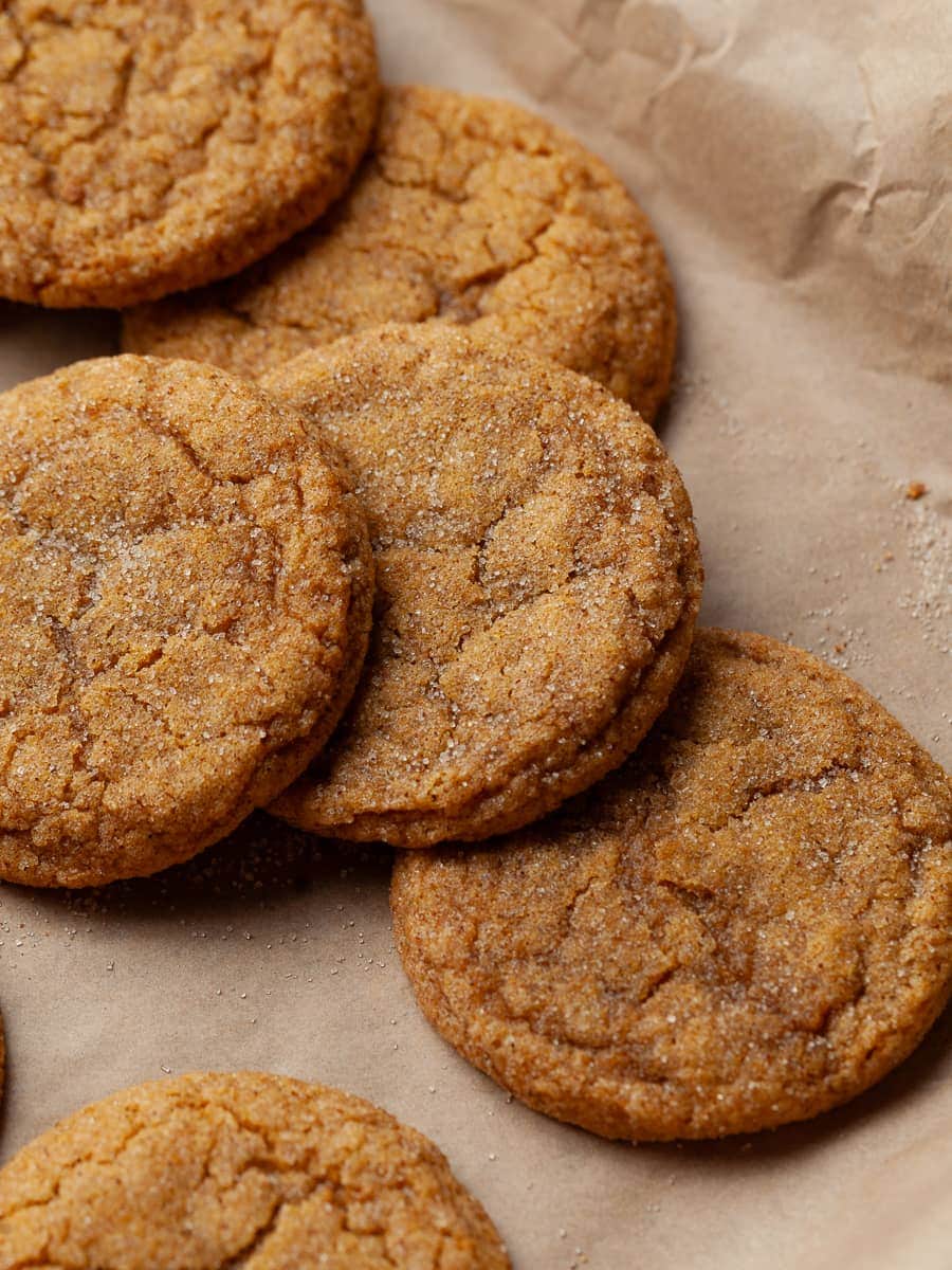 freshly baked pumpkin cookies on brown parchment paper