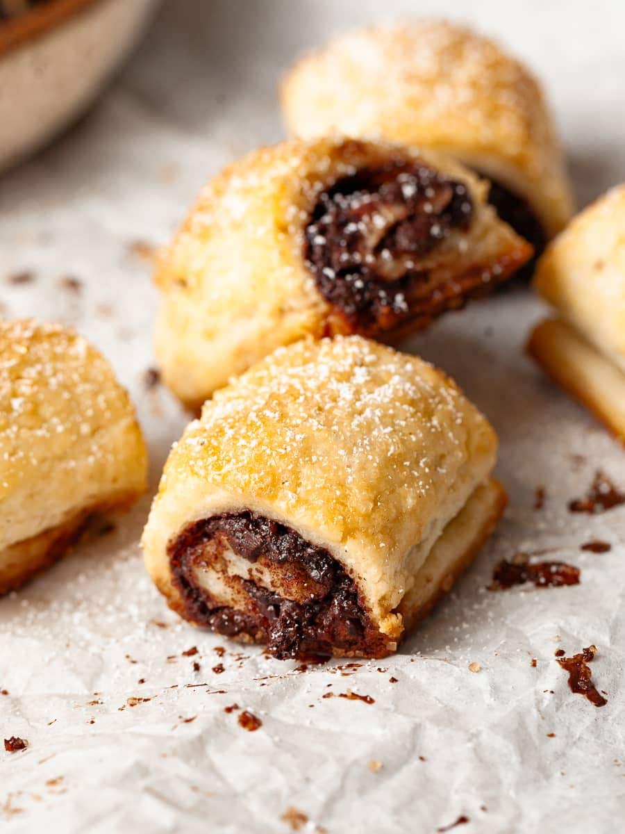 Gluten Free Rugelach with Chocolate Filling on White parchment paper on a sheet tray