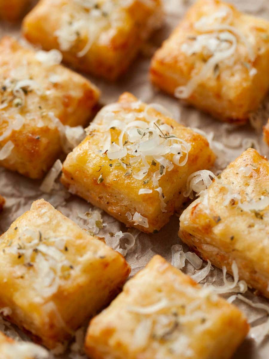 gluten free cheese crackers made with gluten free puff pastry, topped with sharp cheddar cheese