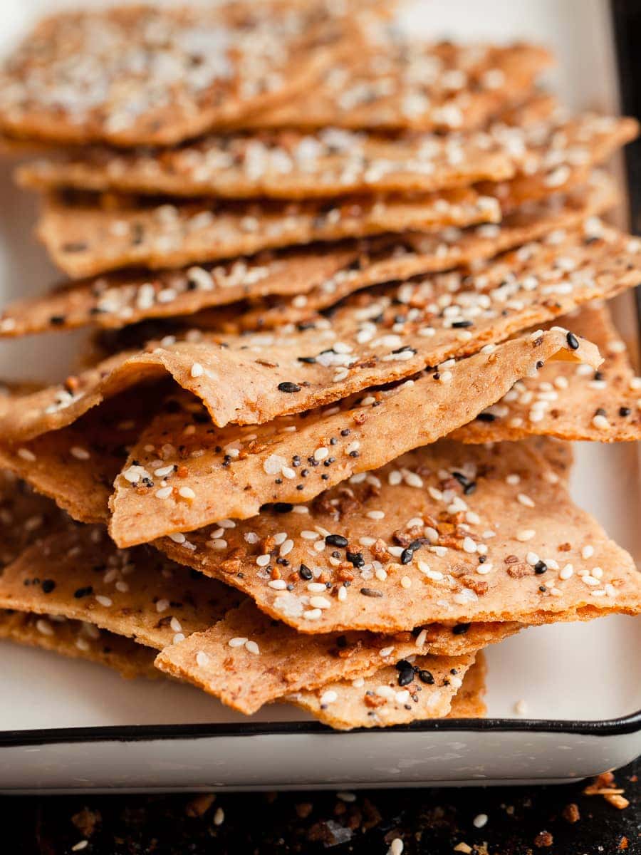 a stack of gluten free sourdough discard crackers on a plate