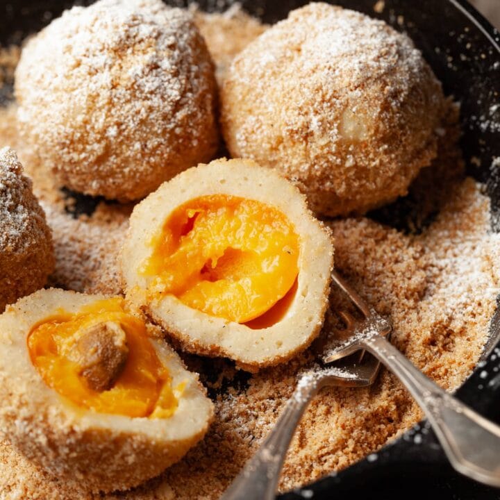 Discover Austria's famous Marillenknödel, gluten-free and perfect for apricot season. Sweet apricots wrapped in dough, boiled, and coated in sweet breadcrumbs.