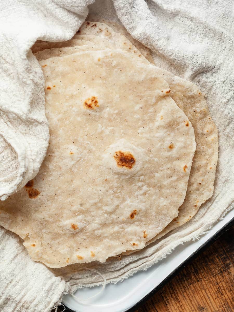 a close up of gluten free flour tortilla on a plate