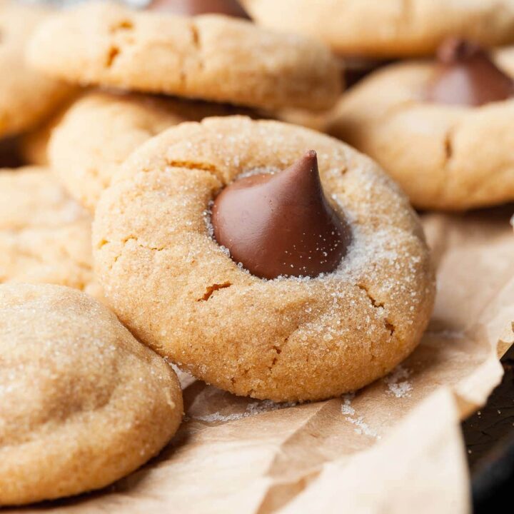 These Gluten Free Peanut Butter Blossoms are soft, chewy, and crowned with a chocolate kiss that makes them impossible to resist. This classic Christmas cookie recipe is perfect for the holidays - or any day you need a little sweet magic.