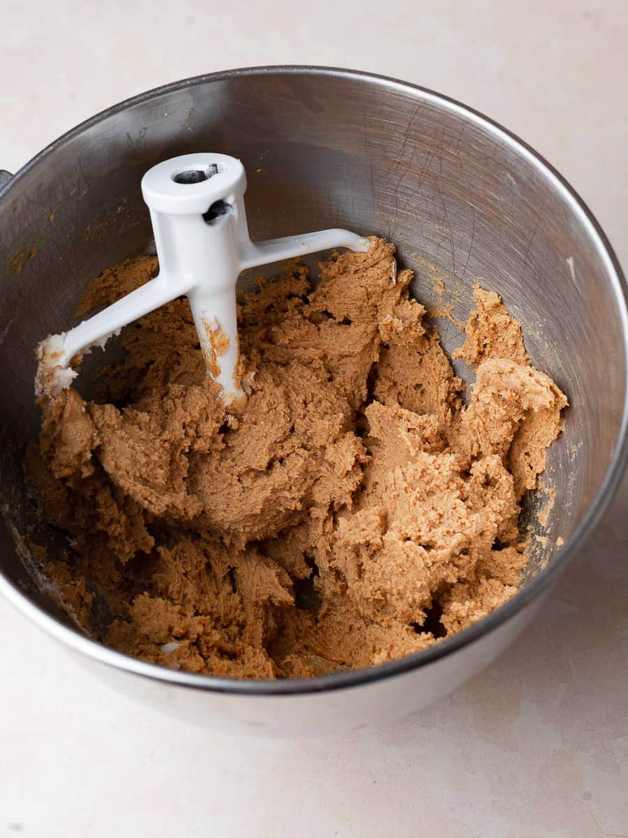 gluten free gingersnap cookie dough in a bowl of a standmixer
