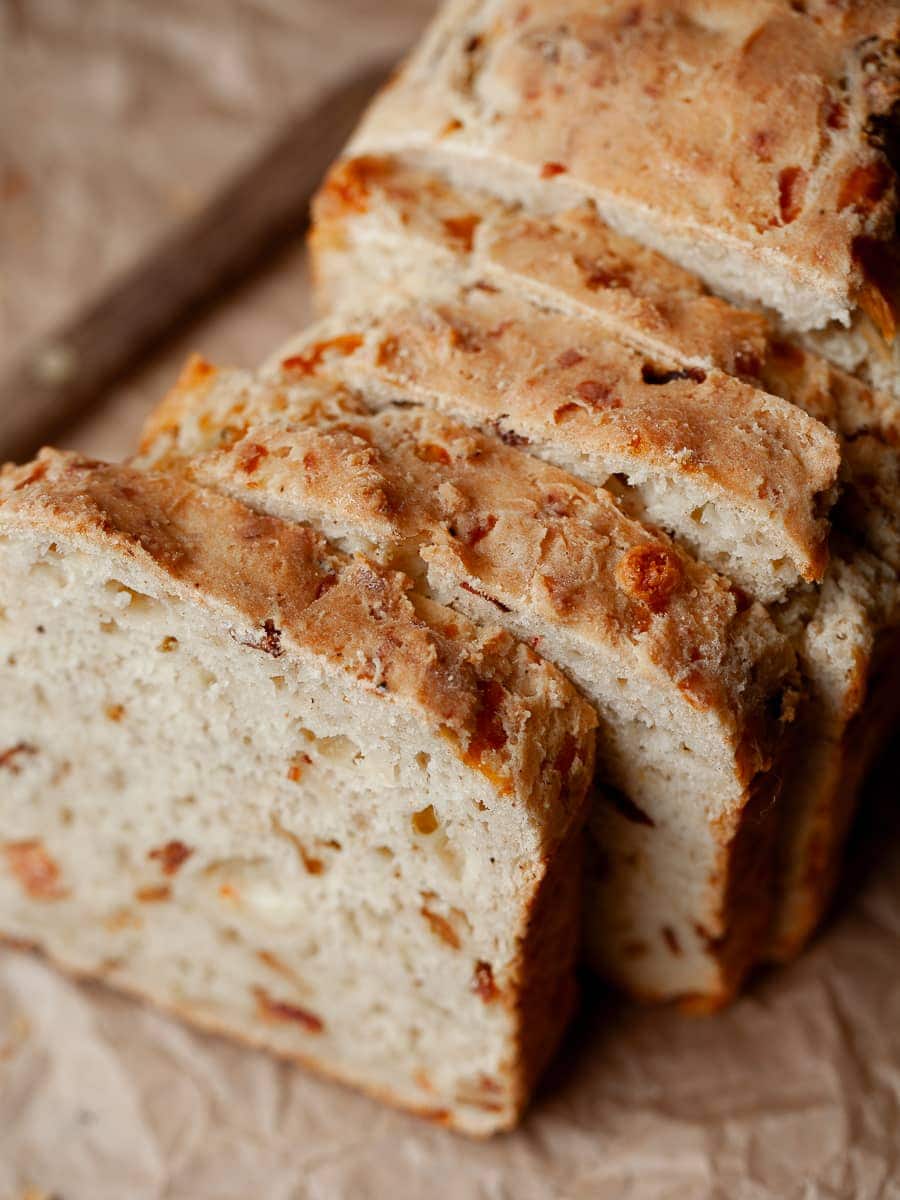 a close up of a savory gluten free quick bread with bacon and cheese