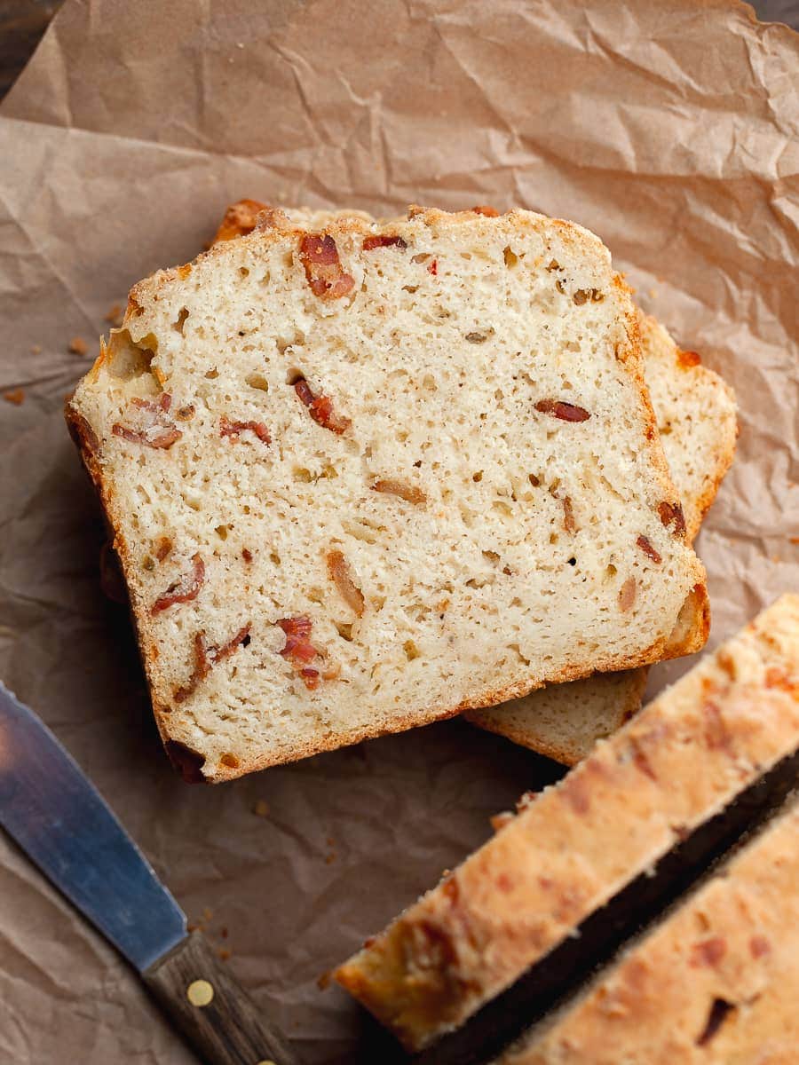 a slice of gluten free savory quick bread with bacon and cheese