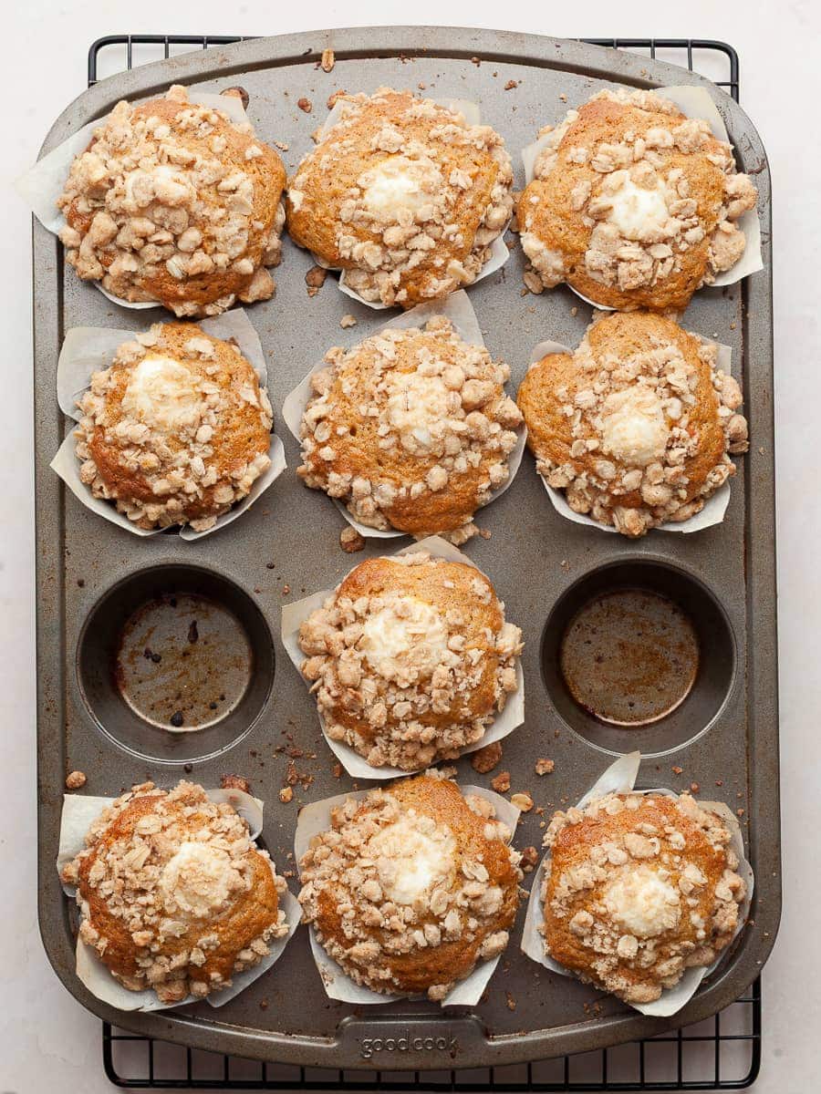 gluten free carrot cake muffins with cream cheese filling and oat streusel