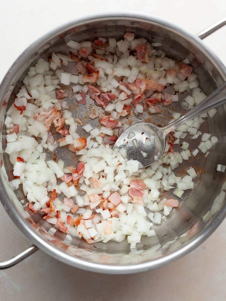 cooked onions and bacon in a pot