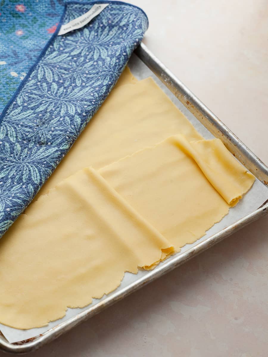 fresh gluten free lasagna pasta on parchment paper