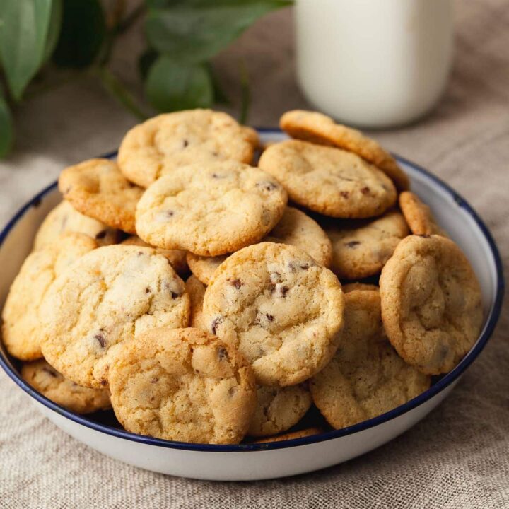 If you love thin and crispy cookies, these Gluten Free Mini Chocolate Chip Cookies are going to be hard to resist. They bake up buttery, crisp, and packed with mini chocolate chips, with the perfect light crunch in every bite. Their small size makes them dangerously easy to snack on by the handful straight from the cookie jar.