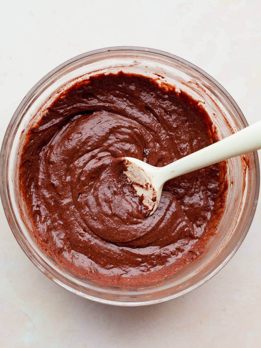 gluten free chocolate waffle cone batter in a bowl with a spatula