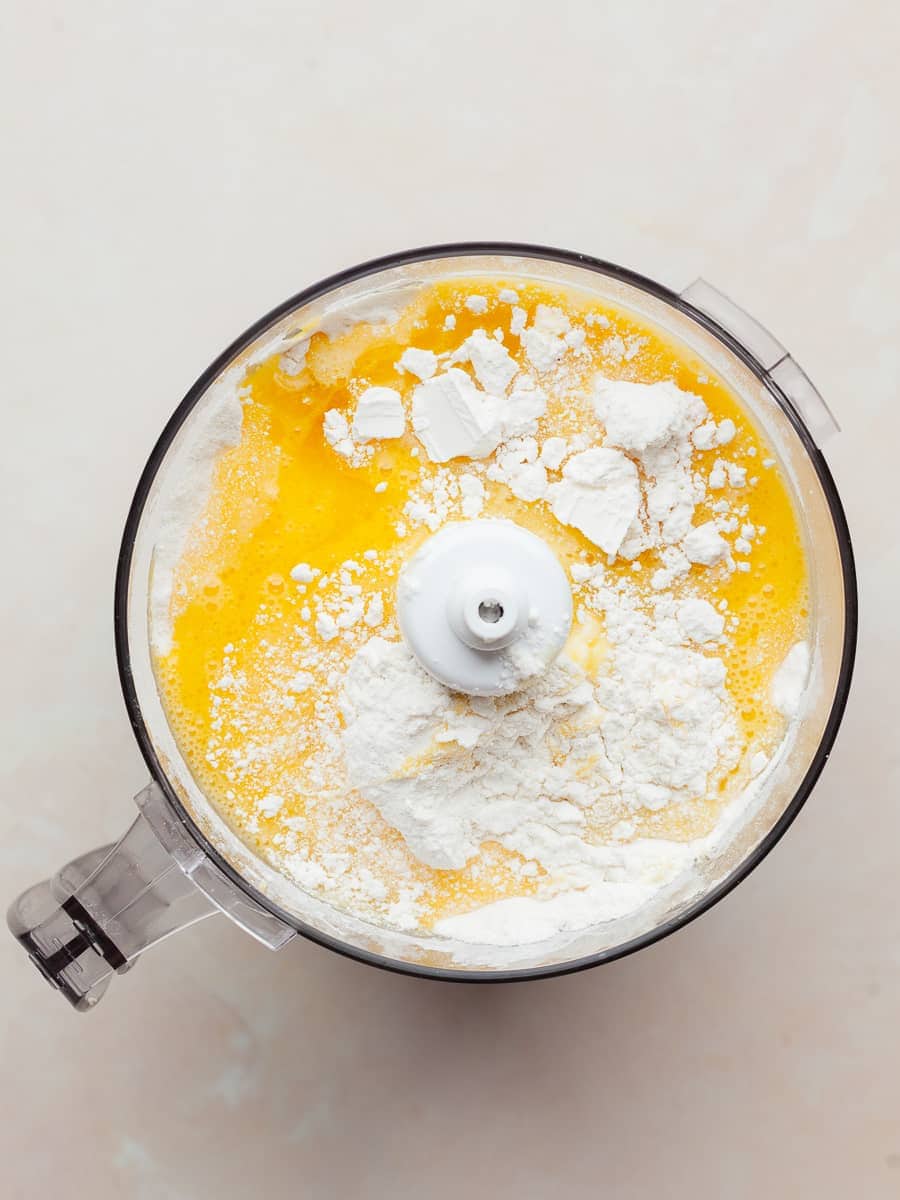 gluten free flour and a mixture of eggs, egg yolk and oil in the food processor for gluten free pasta dough