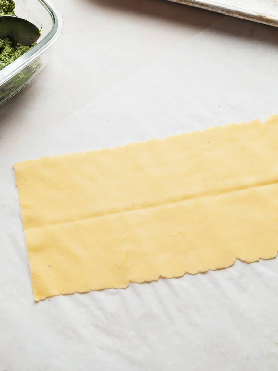 a piece of fresh pasta with a folding line in the middle