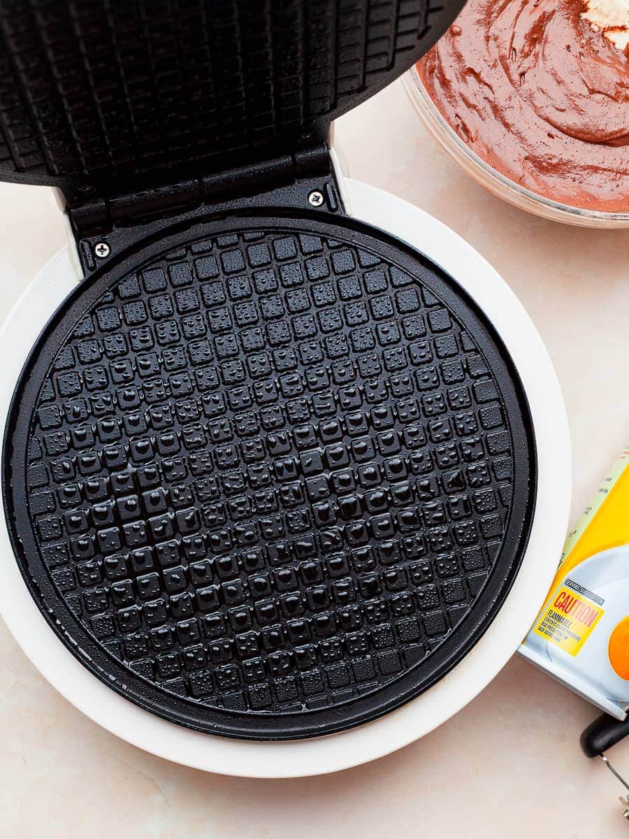 a waffle cone maker sprayed with non stick cooking spray