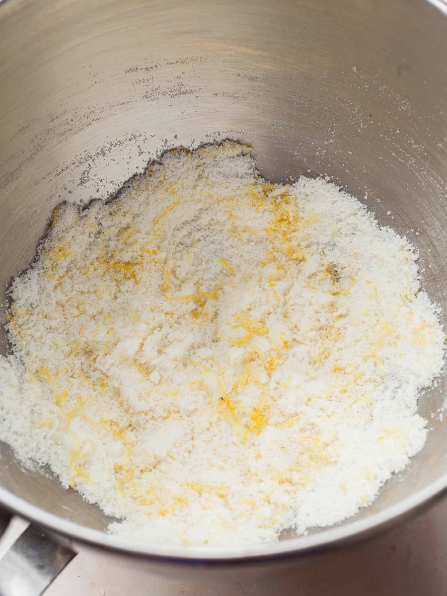 bowl of stand mixer with lemon zest sugar needed to make lemon poppy seed loaf