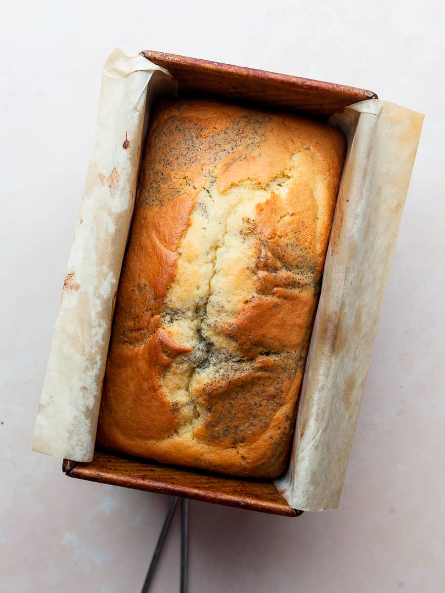 baked lemon poppy seed loaf made with gluten free ingredients in a loaf pan