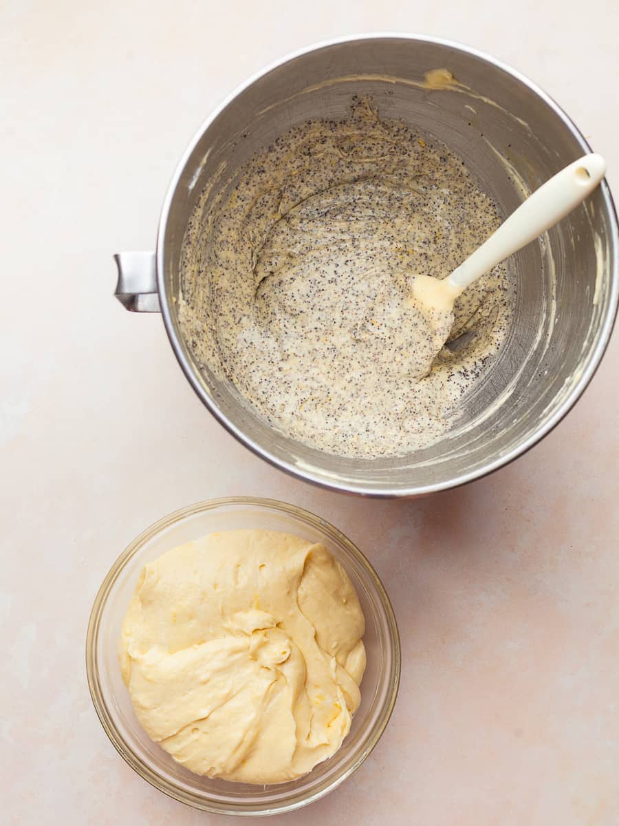 divided lemon poppy seed cake batter, one plain and one with ground poppy seeds