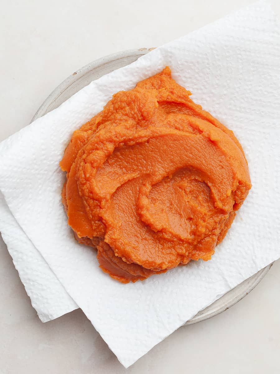 a plate lined with paper towels and pumpkin puree